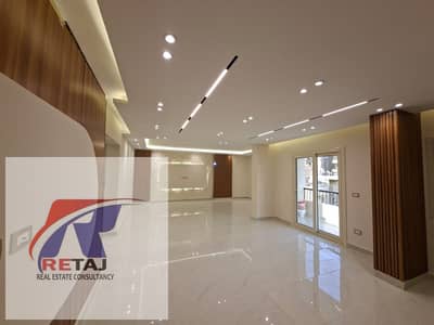 A distinctive apartment in Nasr City, First District, off Ahmed Hosny Street, on El Feda Street. Brand new, first occupancy, super deluxe finishing. P