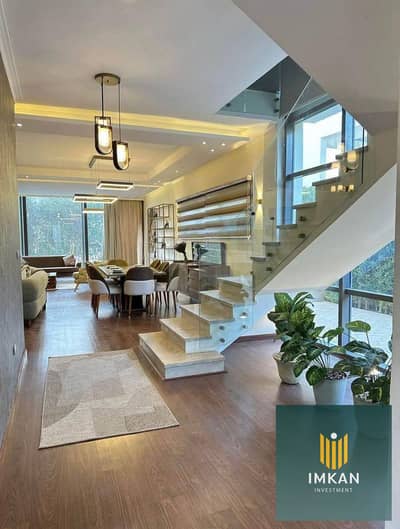 Duplex / 4 rooms / 50% discount for cash / For sale opposite the airport in Taj City Compound - First Settlement - New Cairo