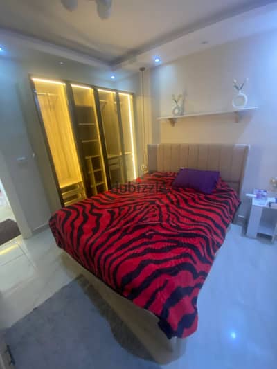 A hotel studio apartment in b12 next to services and the mosque with an open sea view fully air-conditioned smart screen