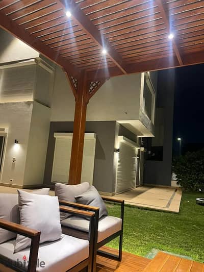 4-bedroom townhouse with lake view and open landscape. Best discount in Sarai on Suez Road, near Madinaty, Al Rehab & Mountain View.