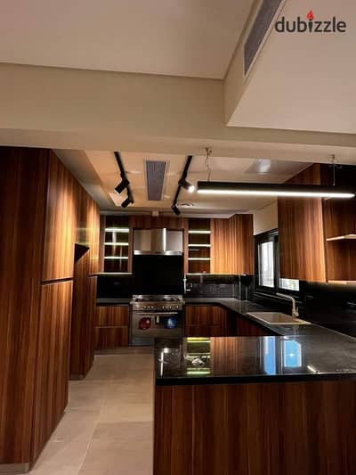 Fully finished apartment for sale in the O West compound, 6th of October City, located on Al-Wahat Road opposite Mall of Egypt.
