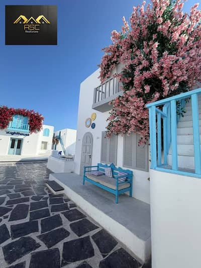 ///Ground floor chalet with garden for sale at Mountain View, Ras El Hekma, North Coast  / Landscape view and swimming pool / 92 Buildings + 60 Garden