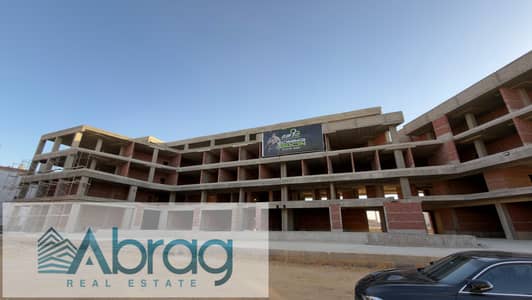 Ground-floor commercial unit for sale, serving a population of 50,000; 7-year installment plan available. Located in the Northern Expansions.