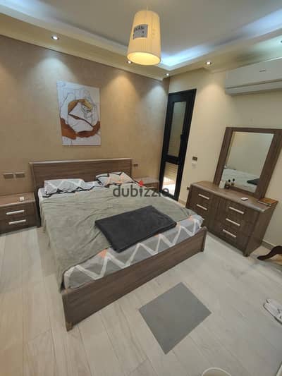 3-room apartment with private garden furnished for rent in Midtown Compound - New Cairo (Ground floor with garden)