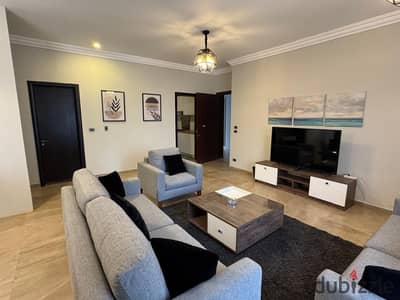 Furnished two-bedroom apartment for rent in Village Gate compound, Palm Hills - New Cairo, next to the American University