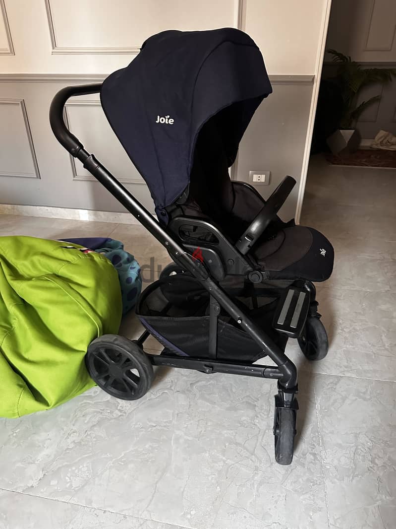 Navy blue stroller and bassinet 1
