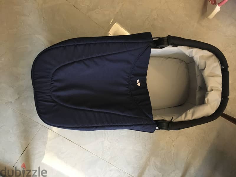 Navy blue stroller and bassinet 8