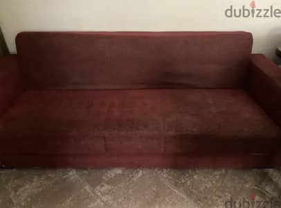 A three seats sofa - burgundy - sofa bed