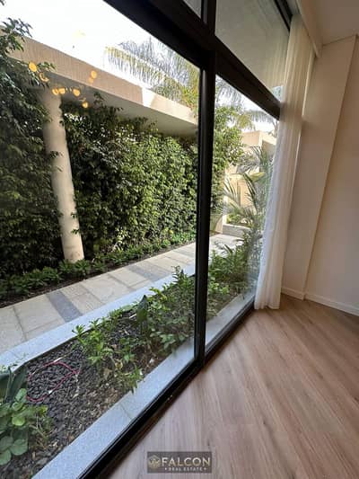Lowest cash price in Taj City, ground floor apartment with garden for sale, opposite Cairo Airport, on the Suez Road, New Cairo
