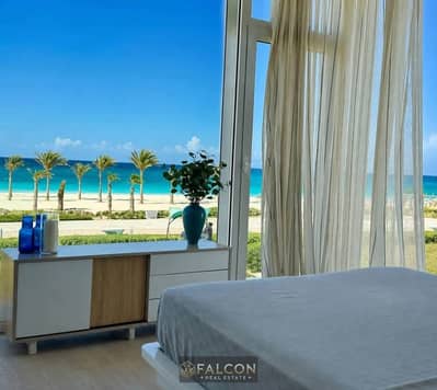 Chalet for sale with a direct sea view, fully finished, in Makadi Heights, Red Sea, with installments over 7 years, near El Gouna city.