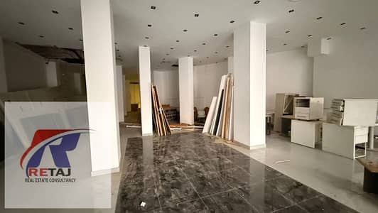 Commercial shop for rent in Heliopolis, Cairo, on a main street with a large frontage, spacious area, and private bathroom. A great investment opportu