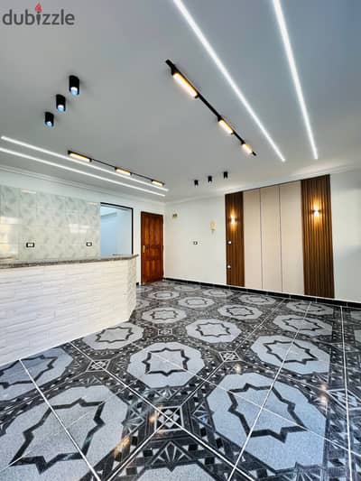 A flat in Al-Ajami, Al-Nakhil Beach, steps to the sea, next to the Defense Ministry Hotel, residential location suitable for investment.
