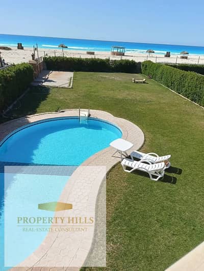A 400 sq m villa, first row on the beach, fully finished, with a private pool and four master bedrooms, ready for viewing, in a prime location in the heart of Ras El Hekma.