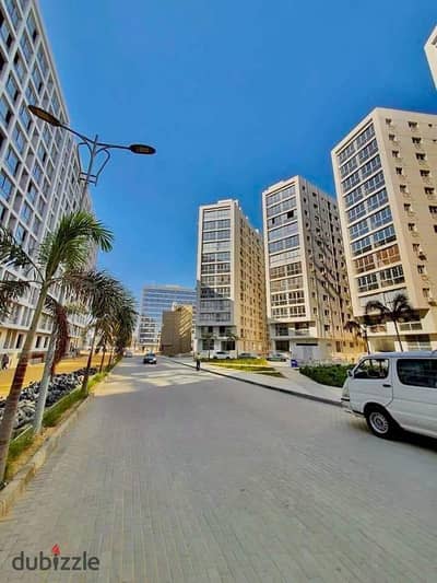 Apartment for sale in Compound One Katameya 155 meters semi-finished with garage open view on the administrative towers and excellent internal division