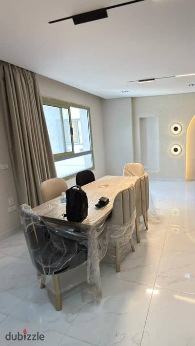 Apartment for sale in Compound One Katameya 120 m super lux excellent internal division and pool view with kitchen and air conditioning and appliances