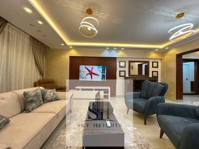 Furnished apartment for rent in Al Rehab 2, first occupancy, ground floor with a garden, ultra-super-lux finishes, modern furniture, and a great price.
