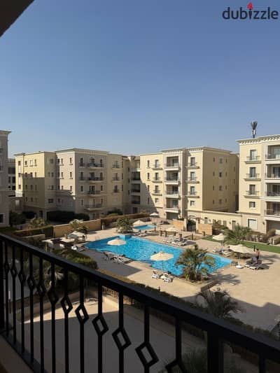 Apartment for rent in Mufida Boulevard compound overlooking the swimming pool with kitchen and air conditioning