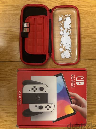 Nintendo Switch OLED with cover and 2 games