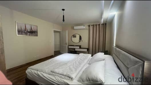 Furnished apartment for rent in the B6 Villas area, overlooking Magra El-Seil. It features 3 bedrooms, high-end finishes, and upscale furnishings.