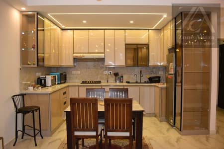 Furnished 3-bedroom apartment for rent in Stone Residence Compound, Katameya, Cairo, with kitchen.