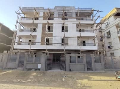 Ground apartment 200 meters with a 90-meter garden, immediate open view overlooking a square and garden in Al-Narges Al-Jadida, paved street next to all highways
