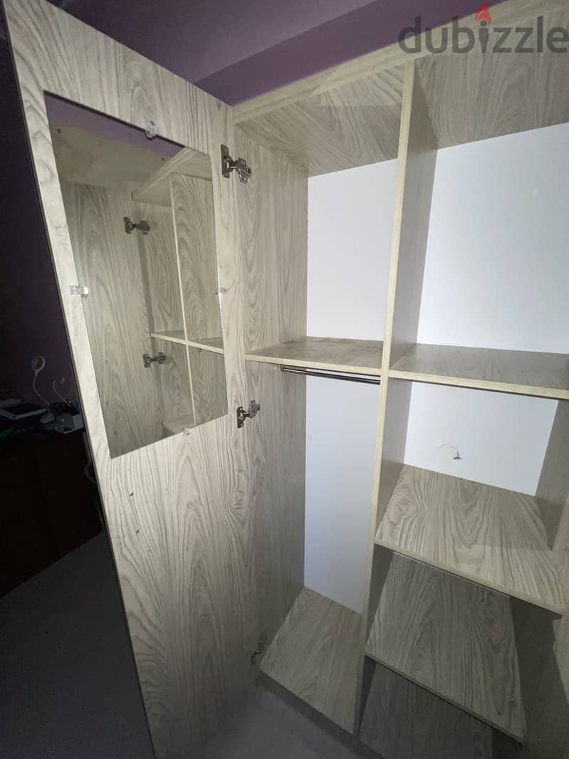 A two door wardrobe in used condition 1