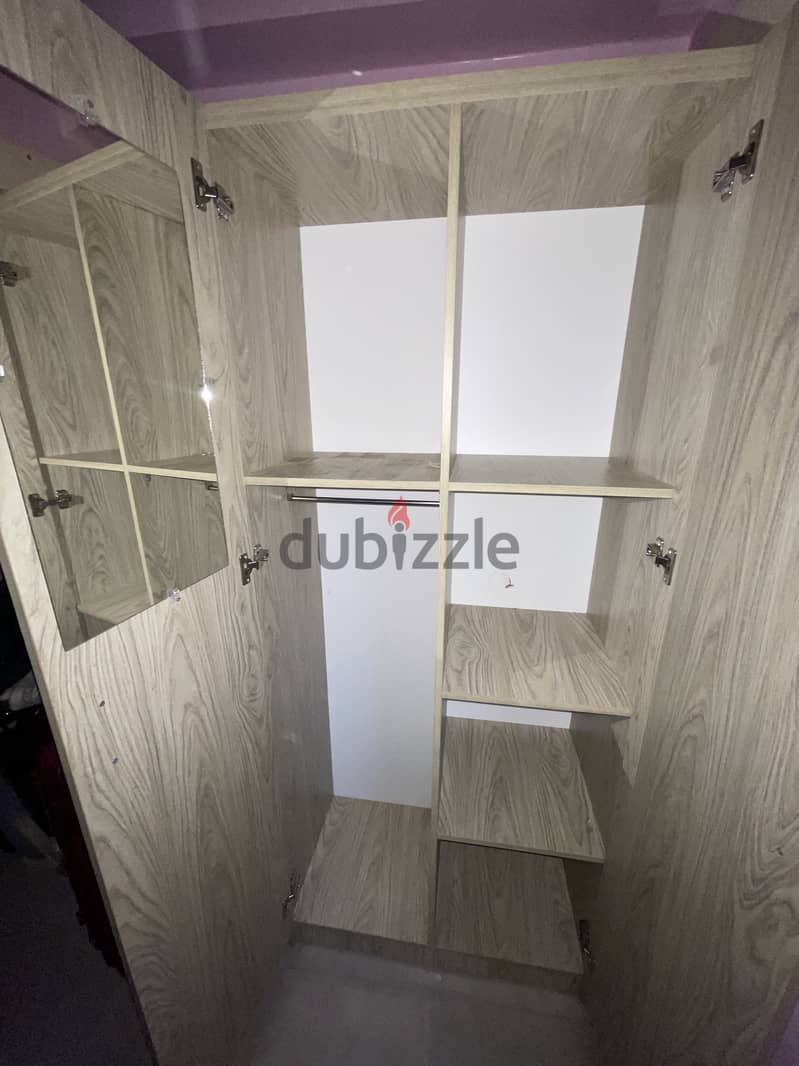 A two door wardrobe in used condition 2