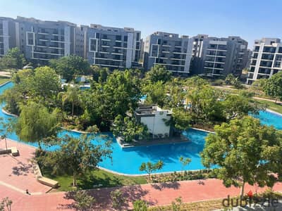 A distinctive apartment for sale in the Sun Capital compound, October Gardens, featuring a prime view overlooking the 5-feddan area.