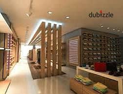 Commercial shop 130 m for sale, high-end finishing, all facilities available: water, electricity, and bathroom in Alexandria, Al-Ajmi, kilo 21, October main street, before the gate, in a very distinguished location.