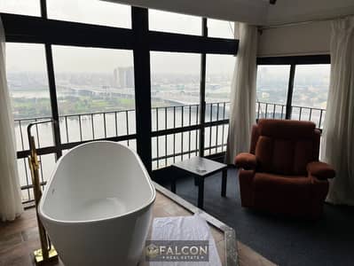شقه علي النيل في الزمالك ( 4 غـرف ماستر - Nile View ) خـدمه مميزه + تشطيب كامل داخل ST Regis الزمالك