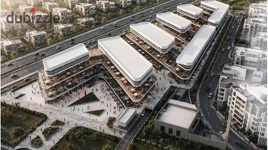Shop 57 m + outdoor 13 m in Seven Complex, October Gardens, in front of Zewail University - 10% down payment and 7 years installment