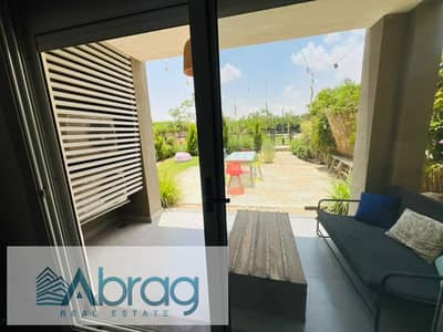 Apartment for rent in Palm Parks Compound, 6th of October City. Features a 93 sqm layout with a garden, a bedroom, a kitchen, and air conditioning.