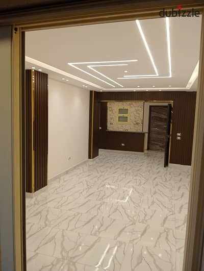 Apartment for sale in Al-Khamail, Phase Three, on the ground floor with a garden, super luxury finishing.