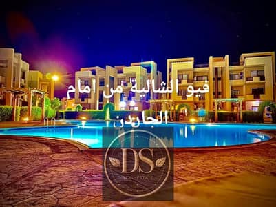For sale: Ground-floor chalet at Blue Bay Asia, 100 sqm, featuring both front and rear gardens. Ultra-super-lux finish with a swimming pool view.