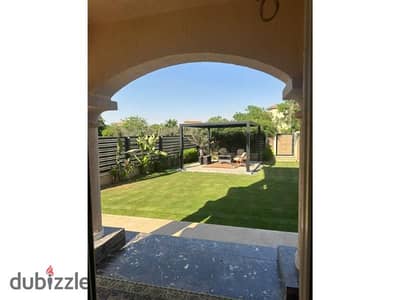 Standalone Villa for Sale in Madinaty - Model G  A prime opportunity for ownership in Phase 2 Villas, featuring a stunning open view of a wide garden.