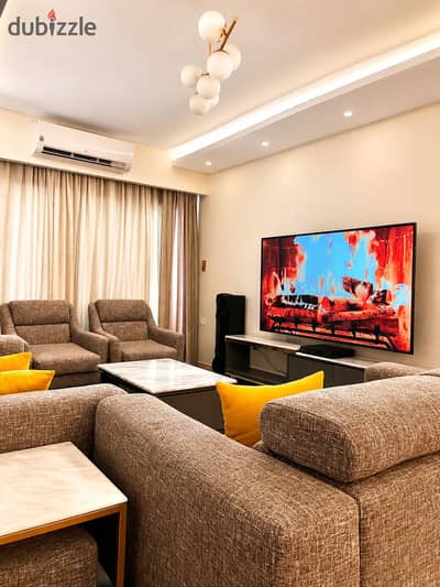 Furnished apartment for rent in Smouha, ultra super lux finishing, luxurious furniture, branded tower, fully air-conditioned, completely open views overlooking Smouha Club, 200m