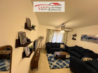 Furnished apartment for rent in Madinaty B12. A distinguished apartment with an area of 107 meters, located on the ground floor overlooking the park, and in an excellent location directly in front of East Hub Mall. The apartment consists of 3 bedrooms.