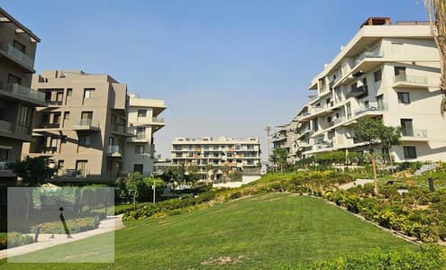 ground apartment with garden fully finished with acs and kitchen prime location direct on pool in SODIC VILLETTE compound