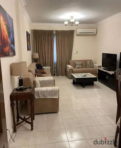 Apartment for sale with garden view some special finishes Selling with furniture and machi the area is 90M with a layout of 2bedrooms in Al-Rehab