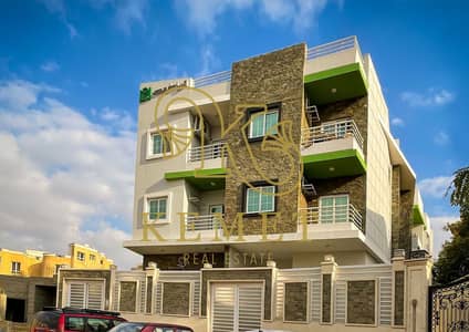 A very distinctive apartment in Al-Narges Al-Jadida 157m repeated floor with a clear income from Gamal Abdel Nasser with garage and storage and studio with garden immediate delivery semi-finishing