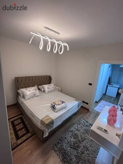 Two-bedroom apartment for rent furnished with garden view in Al Rehab