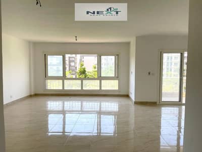 For rent in Madinaty, a new law apartment of 200 sq m in B12, second floor, company finishing, wide garden view, sea view, very close to services, ste