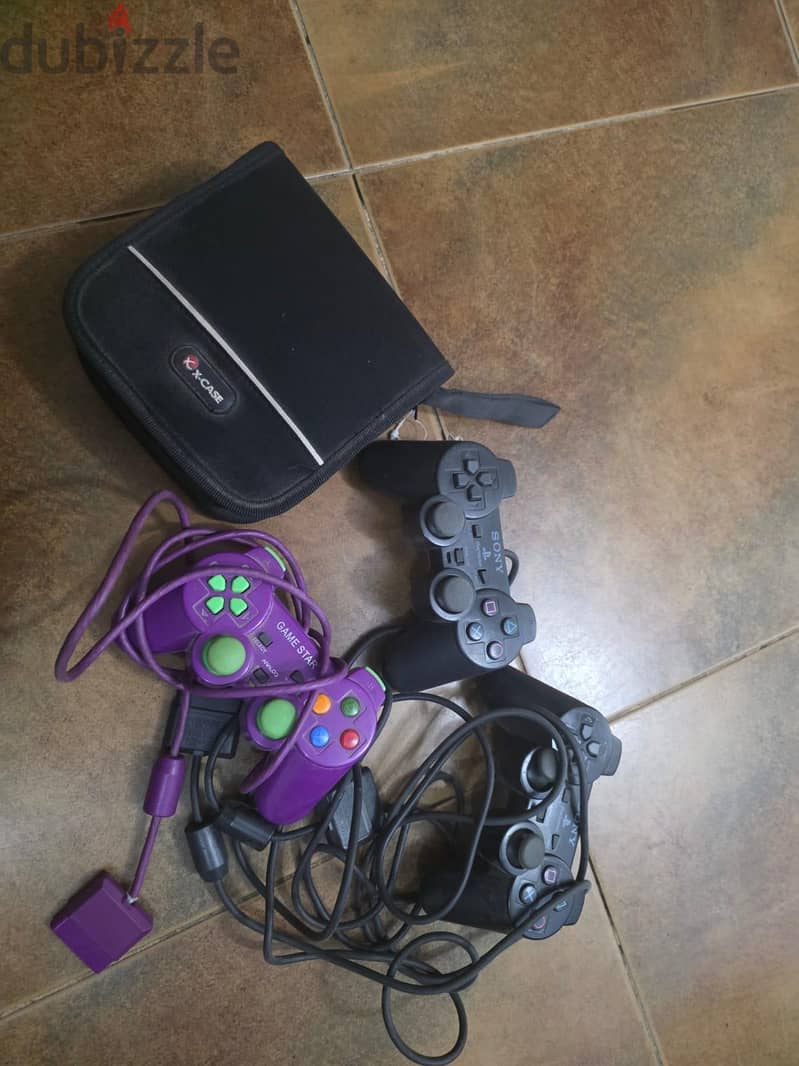 ps2 + games+ stearing wheel 1