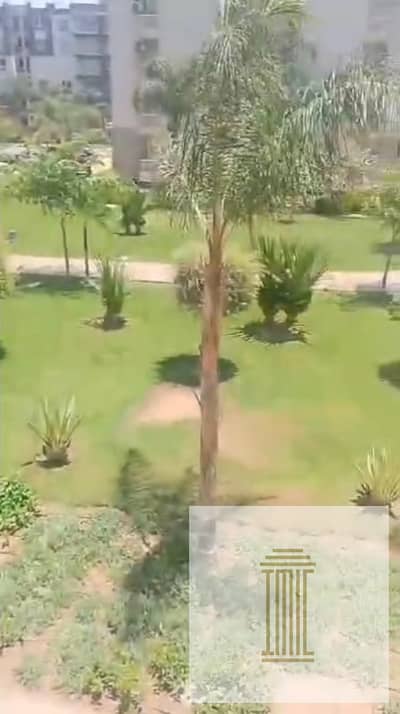 Premium apartment for sale in B12, Madinaty, with an area of 107 square meters, featuring an open view of a garden and a park.