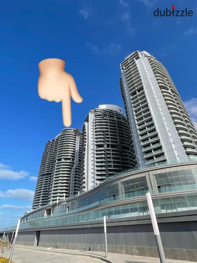 Receive now apartment VIP in El Alamein Towers double-view , directly on the sea, fully finished with hotel finishing, immediate delivery