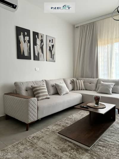 Furnished apartment for rent in Privado Compound, Madinaty. 100 sq m, second floor, lake view, high-end finishing, modern furnishings, fully air-condi