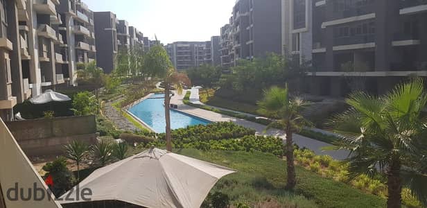 For sale in Sun Capital Compound: A 160m² finished apartment with a distinctive view overlooking the landscape and a lake.