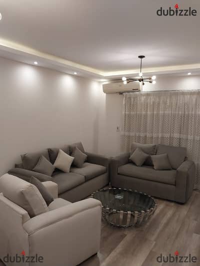 Furnished apartment for rent in Al Rehab, brand new, first occupancy, ground floor with garden, modern furnishings and special finishes, fully air-con