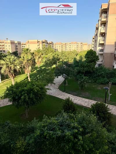 Apartment for sale in Madinaty, B11, in a prime location with super-lux finishes, Talaat Mostafa, pure price, wide garden view, and unique.
