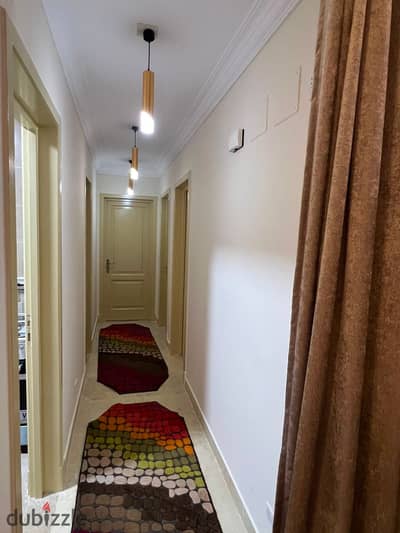 A 3-bedroom, 2-bathroom apartment for rent, fully furnished and at an affordable price, in Madinaty.